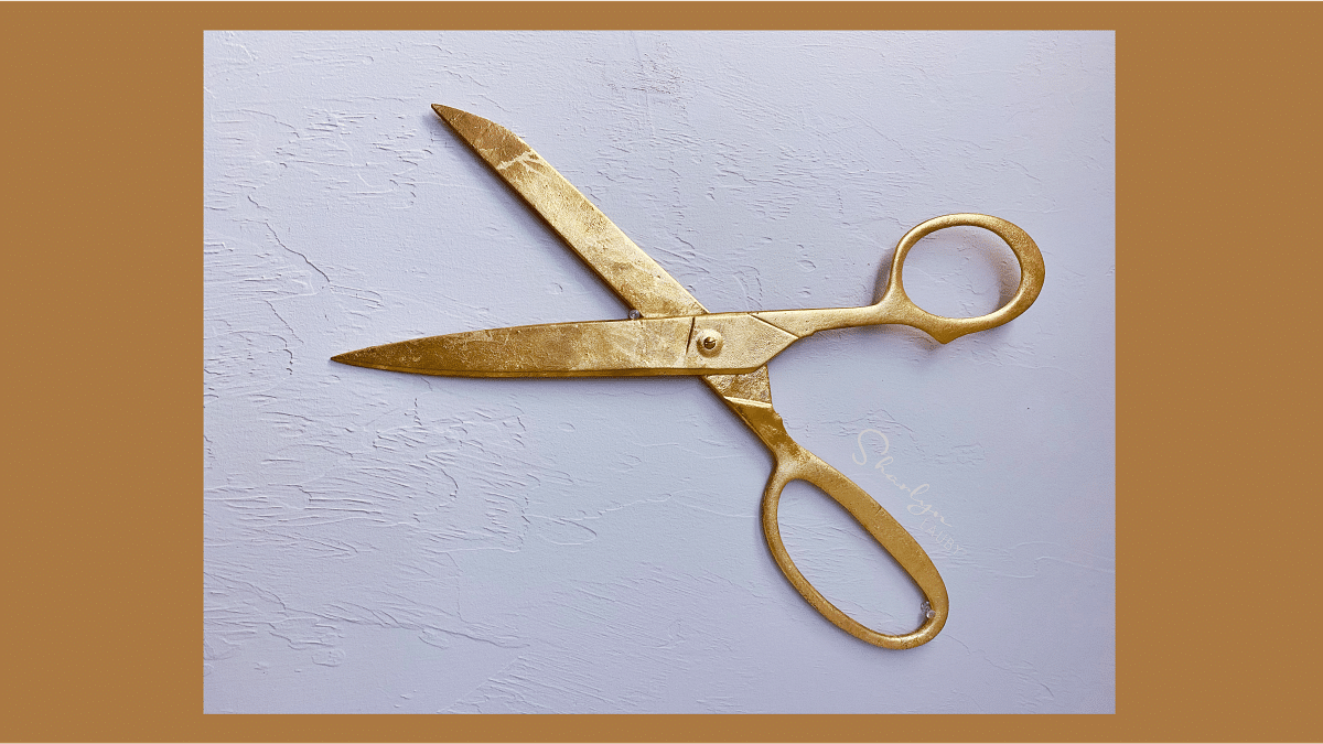 wall art scissors representing budget cut